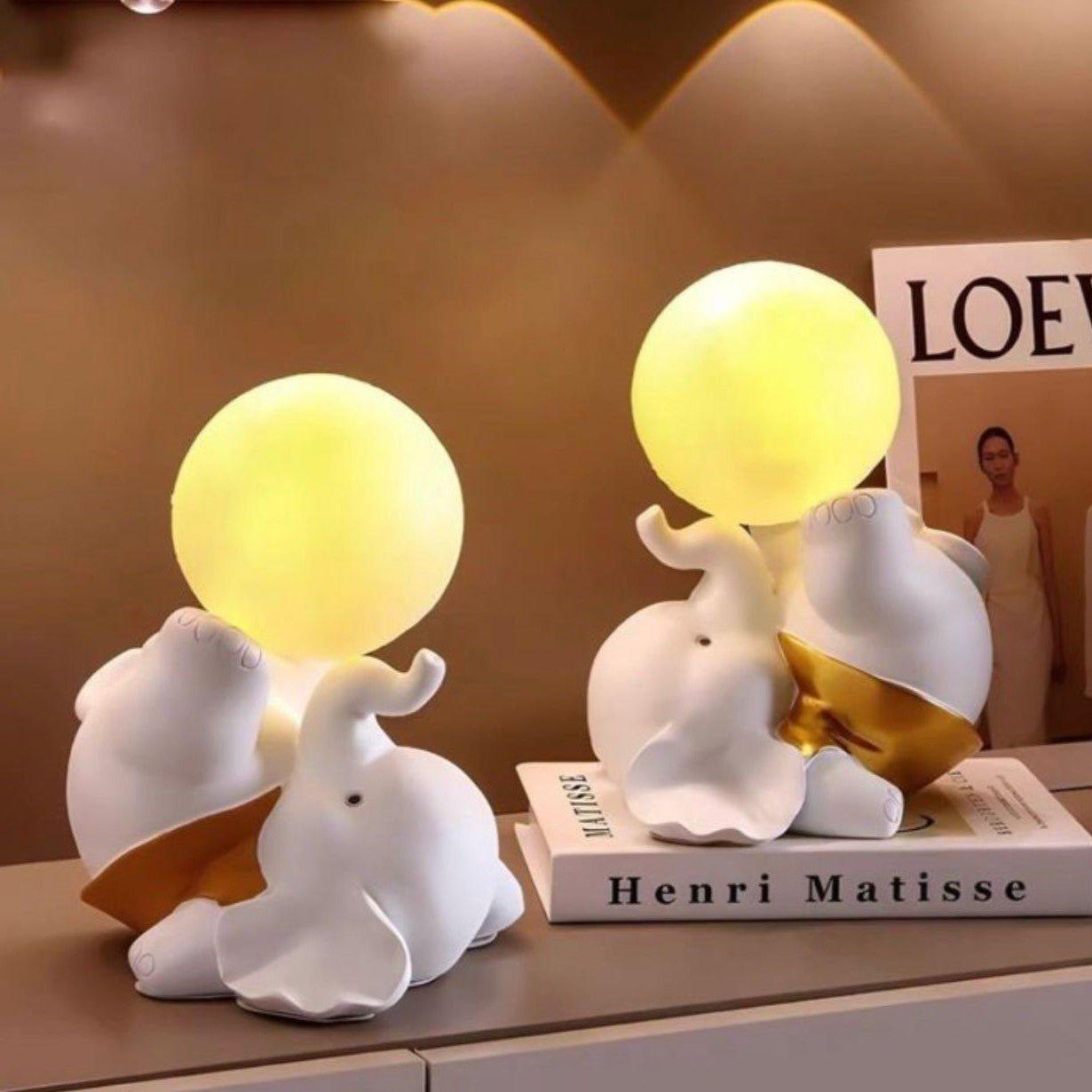 Joyful Baby Elephant with lamp